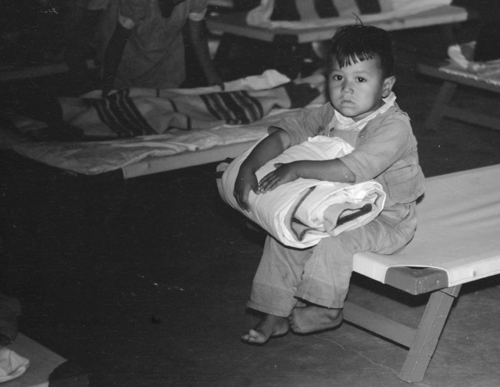 Sleepy child, nursery school, FSA camp, Sinton, Texas, Ebruary 1942. Photographer: Arthur Rothstein